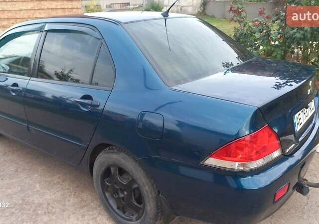 Синій Міцубісі Lancer, об'ємом двигуна 1.58 л та пробігом 220 тис. км за 4200 $, фото 6 на Automoto.ua