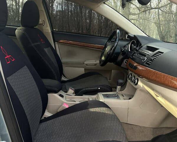 Синий Мицубиси Лансер, объемом двигателя 1.5 л и пробегом 250 тыс. км за 5150 $, фото 13 на Automoto.ua