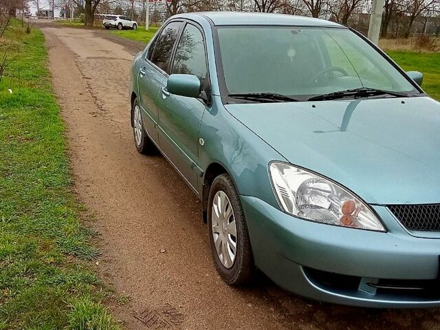 Синій Міцубісі Lancer, об'ємом двигуна 1.6 л та пробігом 167 тис. км за 4700 $, фото 7 на Automoto.ua
