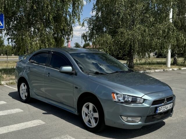 Синий Мицубиси Лансер, объемом двигателя 2 л и пробегом 278 тыс. км за 5750 $, фото 6 на Automoto.ua