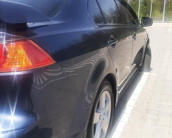 Синій Міцубісі Lancer, об'ємом двигуна 2 л та пробігом 142 тис. км за 8200 $, фото 6 на Automoto.ua