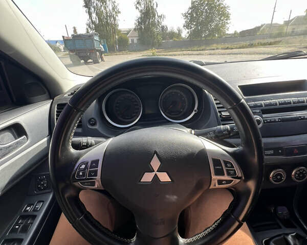 Синий Мицубиси Лансер, объемом двигателя 2 л и пробегом 248 тыс. км за 6600 $, фото 25 на Automoto.ua