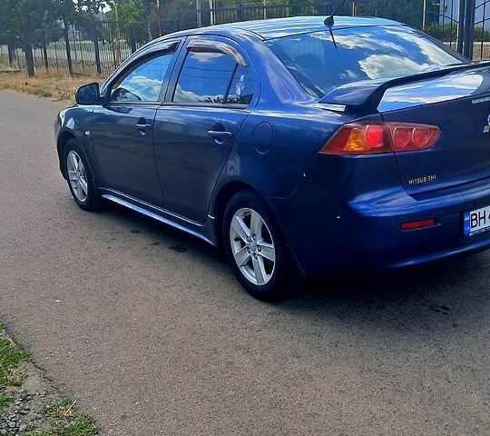 Синій Міцубісі Lancer, об'ємом двигуна 2 л та пробігом 242 тис. км за 5300 $, фото 3 на Automoto.ua