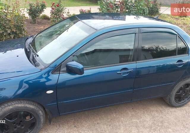 Синій Міцубісі Lancer, об'ємом двигуна 1.58 л та пробігом 220 тис. км за 4200 $, фото 9 на Automoto.ua