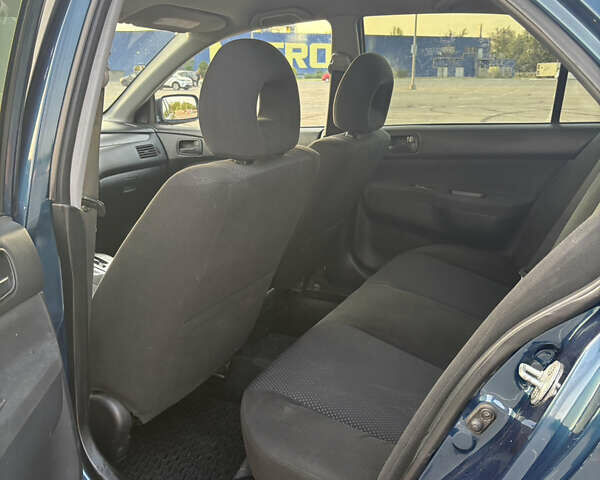 Синій Міцубісі Lancer, об'ємом двигуна 1.58 л та пробігом 167 тис. км за 5700 $, фото 9 на Automoto.ua
