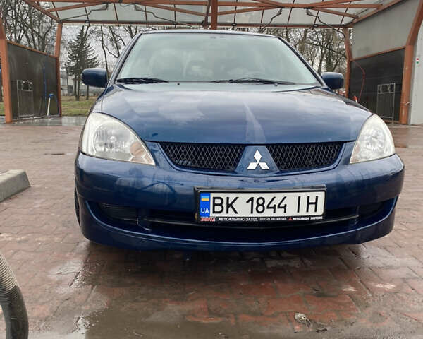 Синій Міцубісі Lancer, об'ємом двигуна 1.6 л та пробігом 225 тис. км за 5750 $, фото 3 на Automoto.ua