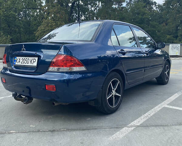 Синій Міцубісі Lancer, об'ємом двигуна 1.6 л та пробігом 206 тис. км за 5500 $, фото 7 на Automoto.ua