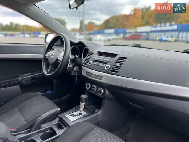 Синій Міцубісі Lancer, об'ємом двигуна 2 л та пробігом 265 тис. км за 6250 $, фото 13 на Automoto.ua