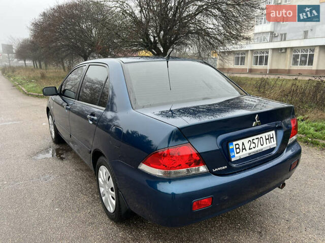 Синий Мицубиси Лансер, объемом двигателя 1.59 л и пробегом 126 тыс. км за 5950 $, фото 4 на Automoto.ua