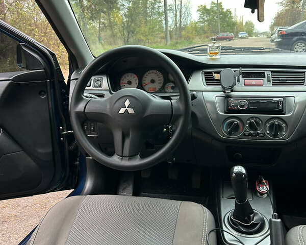 Синий Мицубиси Лансер, объемом двигателя 1.6 л и пробегом 150 тыс. км за 5700 $, фото 42 на Automoto.ua