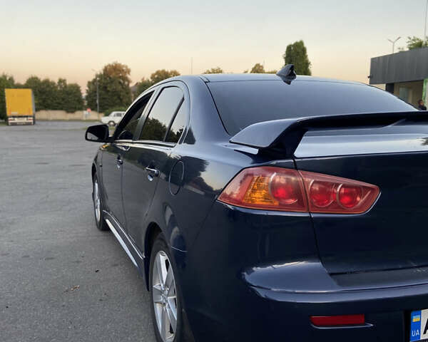 Синий Мицубиси Лансер, объемом двигателя 2 л и пробегом 280 тыс. км за 6900 $, фото 6 на Automoto.ua