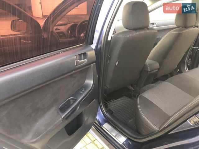 Синий Мицубиси Лансер, объемом двигателя 1.5 л и пробегом 263 тыс. км за 6700 $, фото 49 на Automoto.ua