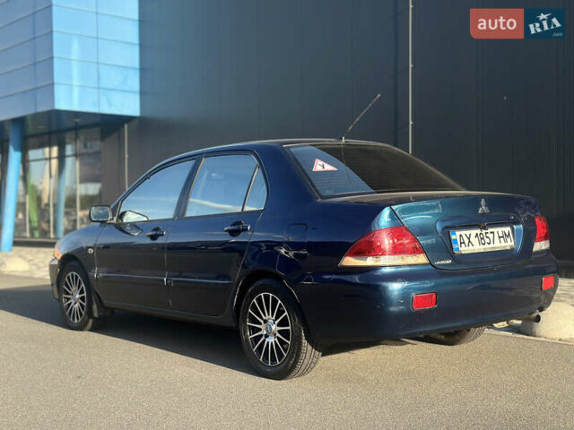 Синій Міцубісі Lancer, об'ємом двигуна 1.6 л та пробігом 191 тис. км за 3700 $, фото 10 на Automoto.ua