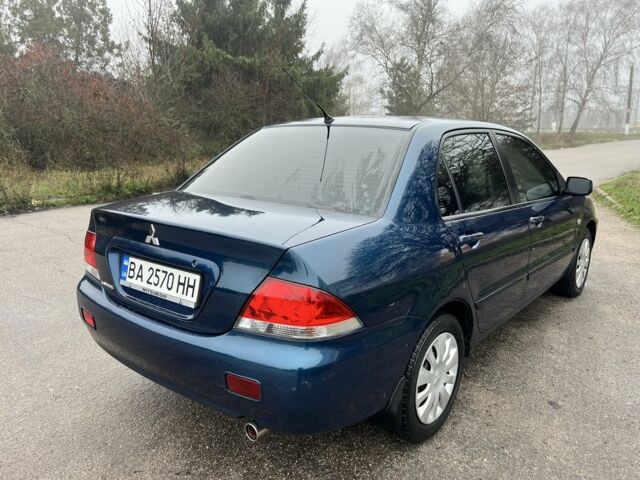 Синій Міцубісі Lancer, об'ємом двигуна 1.6 л та пробігом 126 тис. км за 5950 $, фото 6 на Automoto.ua