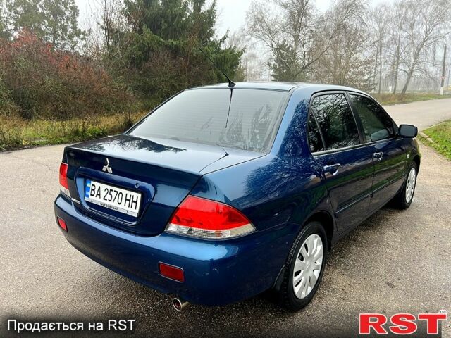 Синий Мицубиси Лансер, объемом двигателя 1.6 л и пробегом 126 тыс. км за 5950 $, фото 5 на Automoto.ua