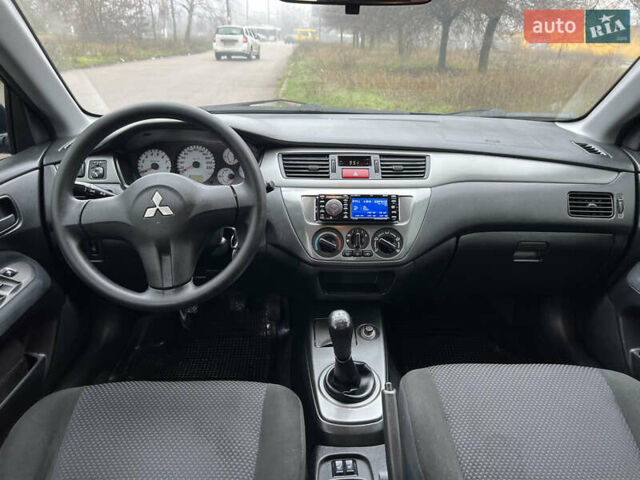 Синий Мицубиси Лансер, объемом двигателя 1.59 л и пробегом 126 тыс. км за 5950 $, фото 10 на Automoto.ua