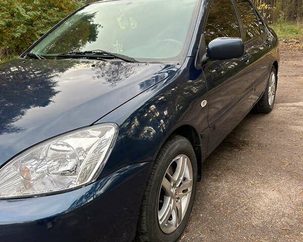 Синий Мицубиси Лансер, объемом двигателя 1.6 л и пробегом 150 тыс. км за 5700 $, фото 8 на Automoto.ua