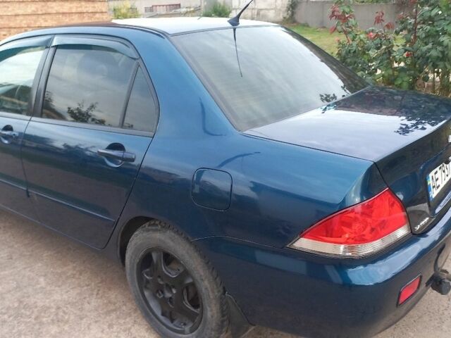 Синій Міцубісі Lancer, об'ємом двигуна 1.6 л та пробігом 220 тис. км за 4200 $, фото 7 на Automoto.ua