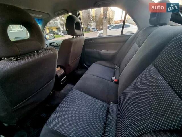 Синій Міцубісі Lancer, об'ємом двигуна 1.6 л та пробігом 298 тис. км за 2998 $, фото 6 на Automoto.ua