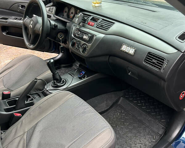 Синий Мицубиси Лансер, объемом двигателя 1.6 л и пробегом 150 тыс. км за 5700 $, фото 43 на Automoto.ua