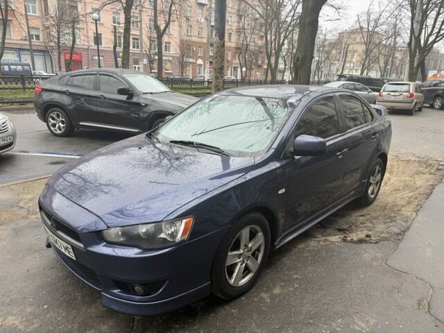 Синий Мицубиси Лансер, объемом двигателя 2 л и пробегом 200 тыс. км за 6700 $, фото 1 на Automoto.ua