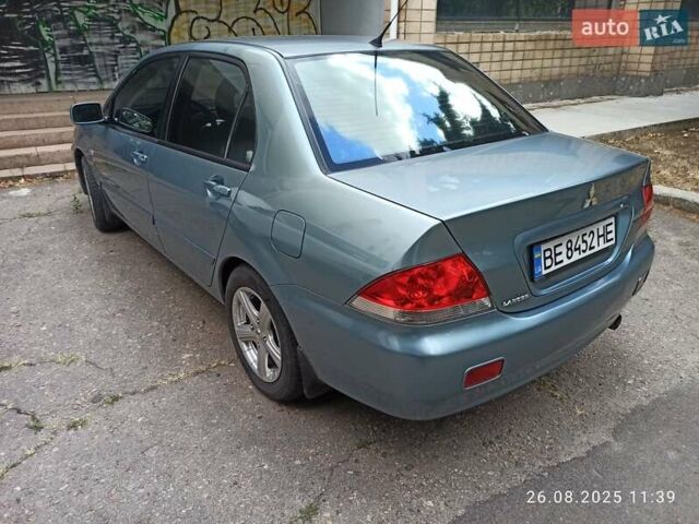 Синий Мицубиси Лансер, объемом двигателя 1.58 л и пробегом 168 тыс. км за 5700 $, фото 7 на Automoto.ua