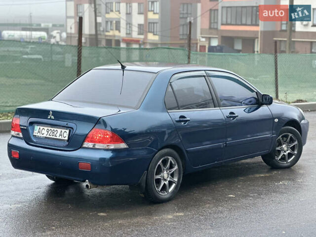 Синий Мицубиси Лансер, объемом двигателя 1.6 л и пробегом 187 тыс. км за 3799 $, фото 14 на Automoto.ua