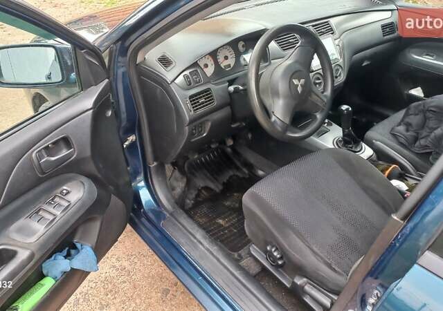 Синій Міцубісі Lancer, об'ємом двигуна 1.58 л та пробігом 220 тис. км за 4200 $, фото 13 на Automoto.ua