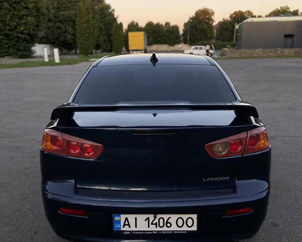 Синий Мицубиси Лансер, объемом двигателя 2 л и пробегом 280 тыс. км за 6900 $, фото 5 на Automoto.ua