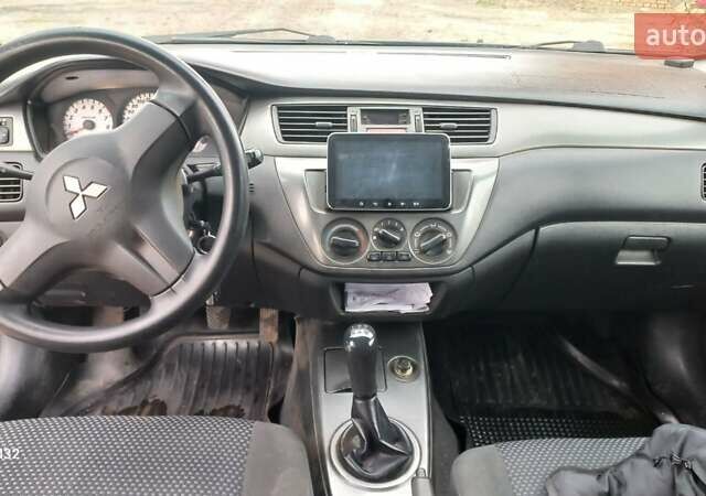 Синій Міцубісі Lancer, об'ємом двигуна 1.58 л та пробігом 220 тис. км за 4200 $, фото 12 на Automoto.ua