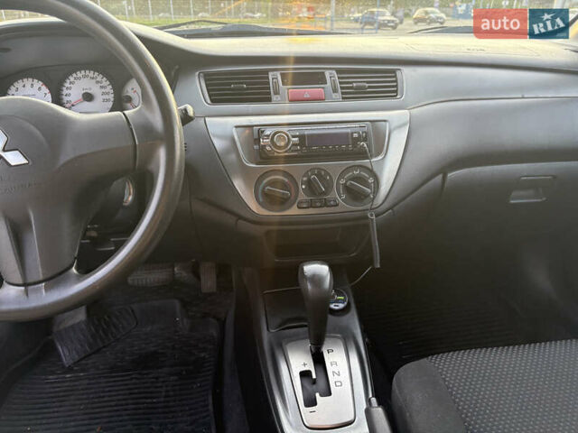 Синій Міцубісі Lancer, об'ємом двигуна 1.58 л та пробігом 167 тис. км за 5700 $, фото 10 на Automoto.ua