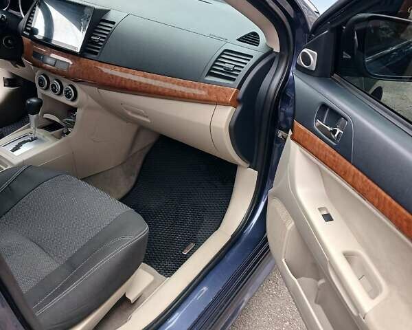 Синий Мицубиси Лансер, объемом двигателя 1.5 л и пробегом 220 тыс. км за 6999 $, фото 4 на Automoto.ua