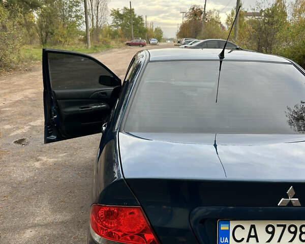 Синий Мицубиси Лансер, объемом двигателя 1.6 л и пробегом 150 тыс. км за 5700 $, фото 1 на Automoto.ua
