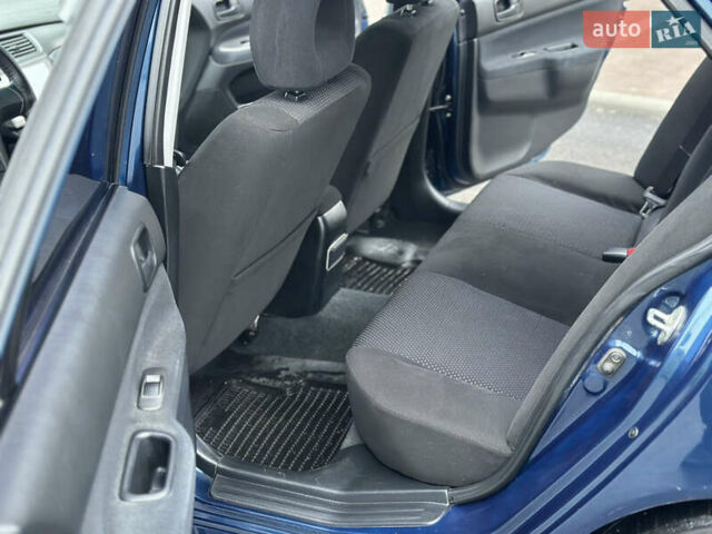 Синий Мицубиси Лансер, объемом двигателя 1.6 л и пробегом 187 тыс. км за 3799 $, фото 18 на Automoto.ua