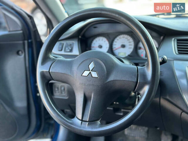 Синій Міцубісі Lancer, об'ємом двигуна 1.6 л та пробігом 250 тис. км за 5499 $, фото 15 на Automoto.ua