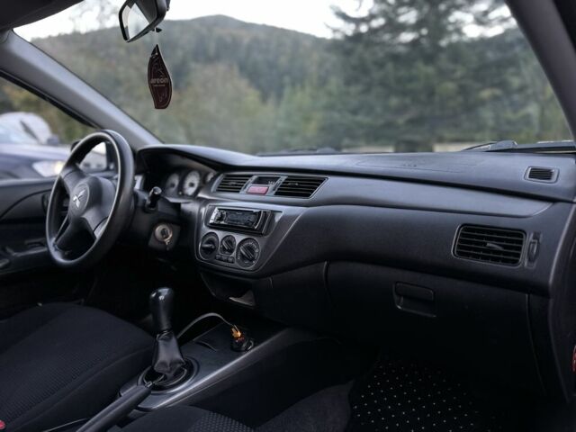 Синий Мицубиси Лансер, объемом двигателя 1.6 л и пробегом 138 тыс. км за 4800 $, фото 15 на Automoto.ua