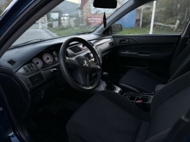 Синий Мицубиси Лансер, объемом двигателя 1.6 л и пробегом 138 тыс. км за 4800 $, фото 13 на Automoto.ua