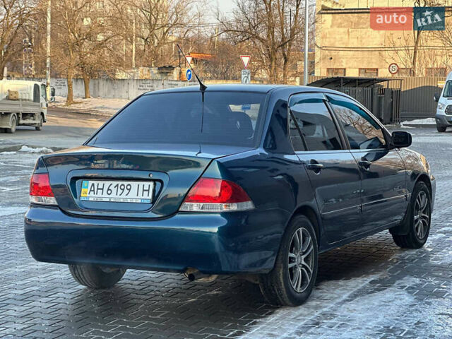 Синій Міцубісі Lancer, об'ємом двигуна 1.6 л та пробігом 250 тис. км за 5499 $, фото 6 на Automoto.ua