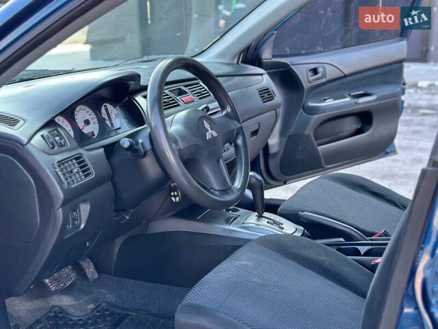 Синій Міцубісі Lancer, об'ємом двигуна 1.6 л та пробігом 250 тис. км за 5499 $, фото 10 на Automoto.ua