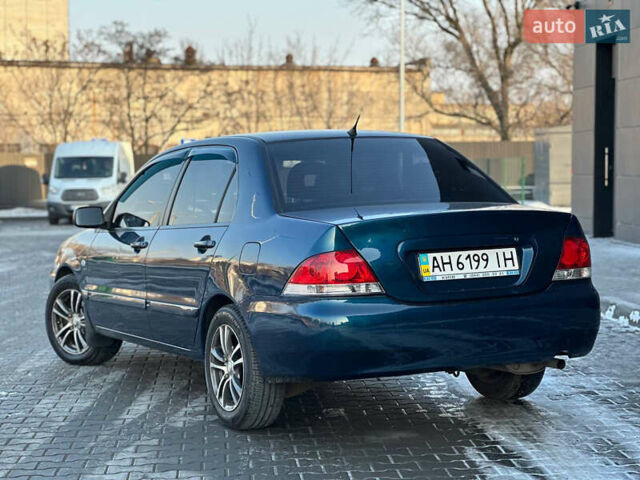 Синій Міцубісі Lancer, об'ємом двигуна 1.6 л та пробігом 250 тис. км за 5499 $, фото 5 на Automoto.ua