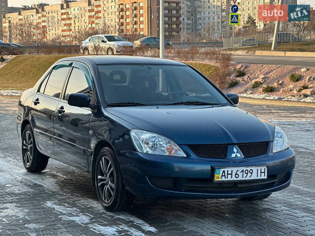 Синій Міцубісі Lancer, об'ємом двигуна 1.6 л та пробігом 250 тис. км за 5499 $, фото 4 на Automoto.ua
