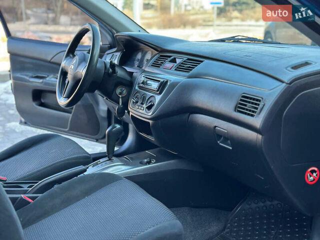 Синій Міцубісі Lancer, об'ємом двигуна 1.6 л та пробігом 250 тис. км за 5499 $, фото 13 на Automoto.ua