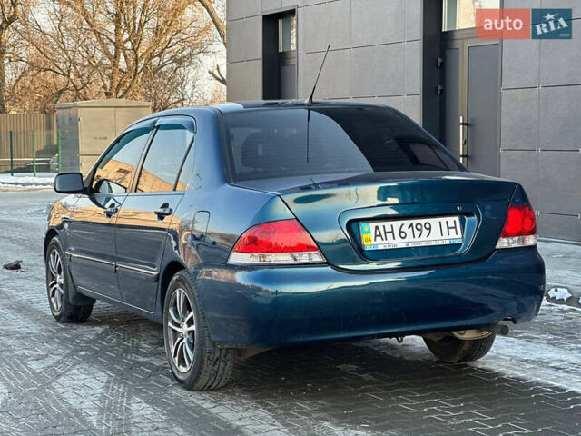 Синій Міцубісі Lancer, об'ємом двигуна 1.6 л та пробігом 250 тис. км за 5499 $, фото 9 на Automoto.ua