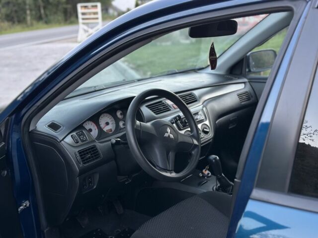 Синий Мицубиси Лансер, объемом двигателя 1.6 л и пробегом 138 тыс. км за 4800 $, фото 12 на Automoto.ua