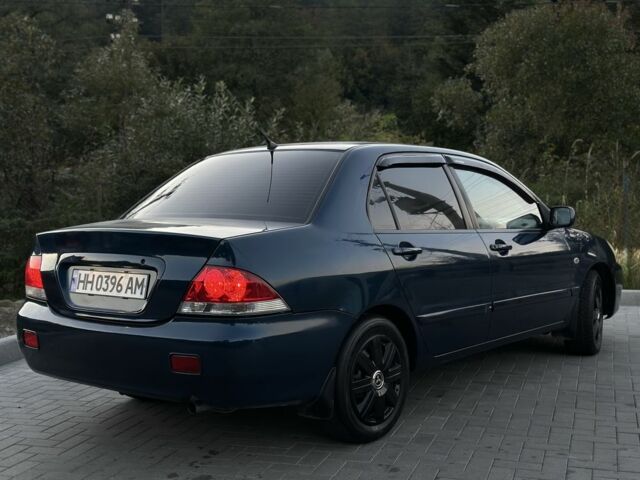 Синий Мицубиси Лансер, объемом двигателя 1.6 л и пробегом 138 тыс. км за 4800 $, фото 7 на Automoto.ua