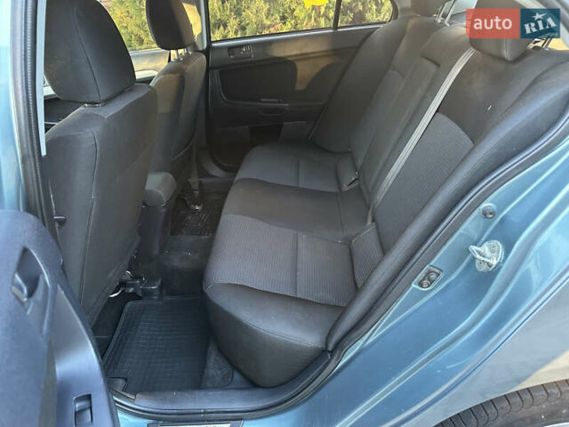 Синий Мицубиси Лансер, объемом двигателя 2 л и пробегом 320 тыс. км за 4999 $, фото 8 на Automoto.ua