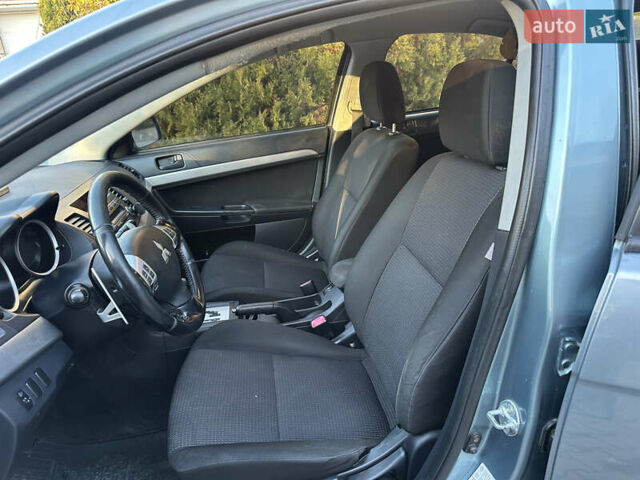 Синий Мицубиси Лансер, объемом двигателя 2 л и пробегом 320 тыс. км за 4999 $, фото 7 на Automoto.ua