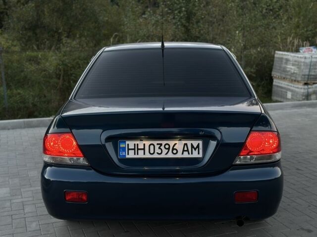 Синий Мицубиси Лансер, объемом двигателя 1.6 л и пробегом 138 тыс. км за 4800 $, фото 10 на Automoto.ua