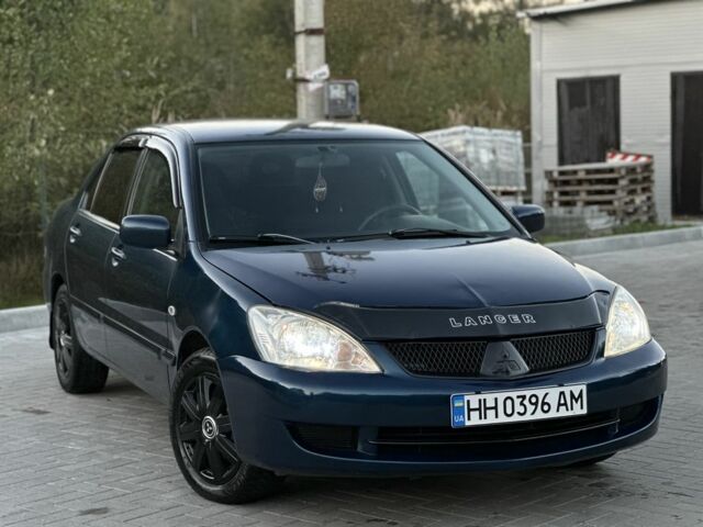 Синий Мицубиси Лансер, объемом двигателя 1.6 л и пробегом 138 тыс. км за 4800 $, фото 6 на Automoto.ua