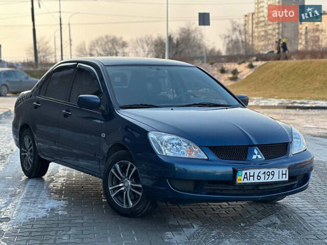 Синій Міцубісі Lancer, об'ємом двигуна 1.6 л та пробігом 250 тис. км за 5499 $, фото 1 на Automoto.ua